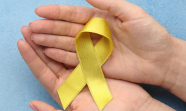 2 hands holding a yellow ribbon. Text on top says "Adults and Teens."